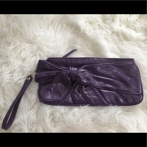 Purple hand clutch